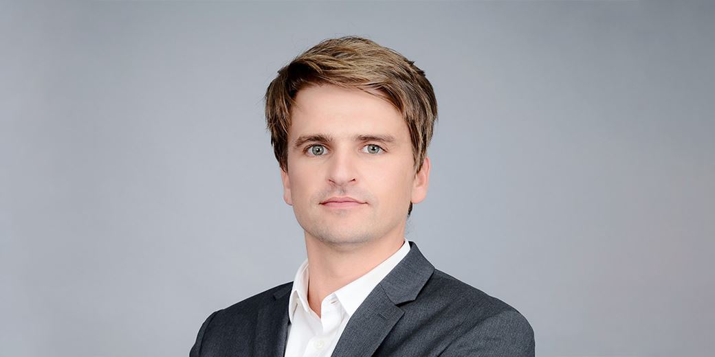 What might make this DFM switch from 100% passive offshore equity exposure?
